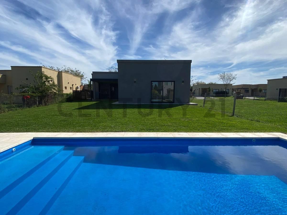 CASA CON PILETA PARQUIZADA EN SAN RAMON — foto 1